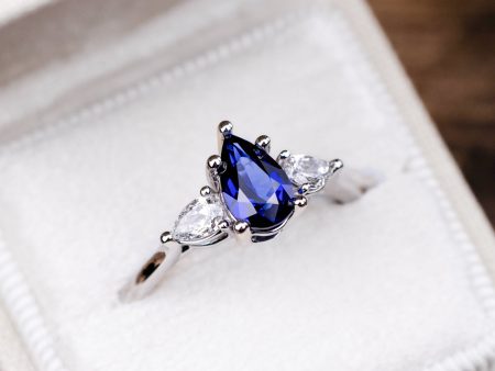 The Diana - Blue Sapphire Pear Cut Three Stone Engagement Ring with Diamond Accents on Sale